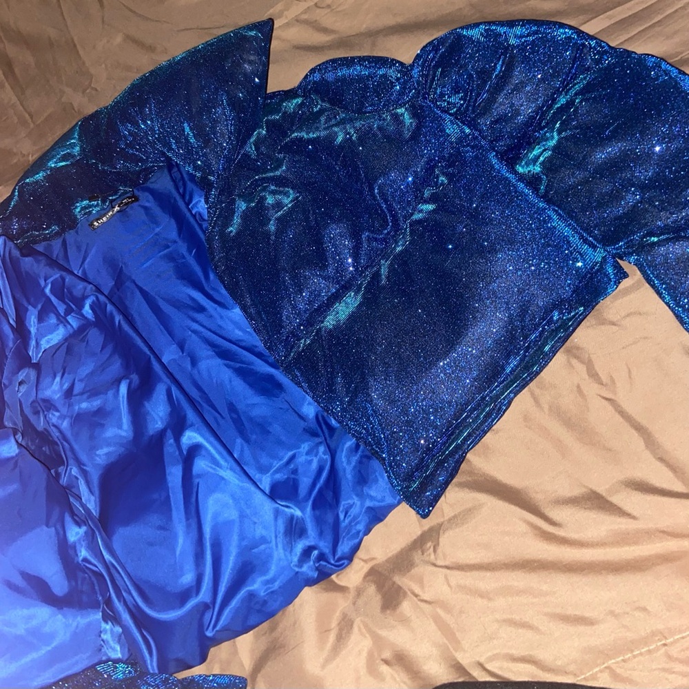 Blue glitter puffer bomber jacket.